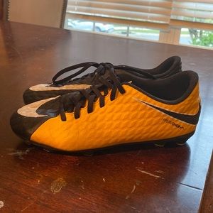 Nike kids cleats orange and black size 5y